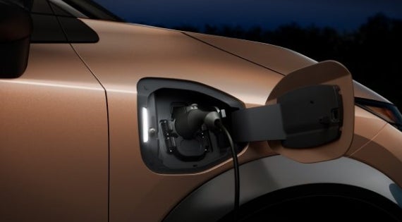 Close-up image of charging cable plugged in | Nissan of Melbourne in Melbourne FL